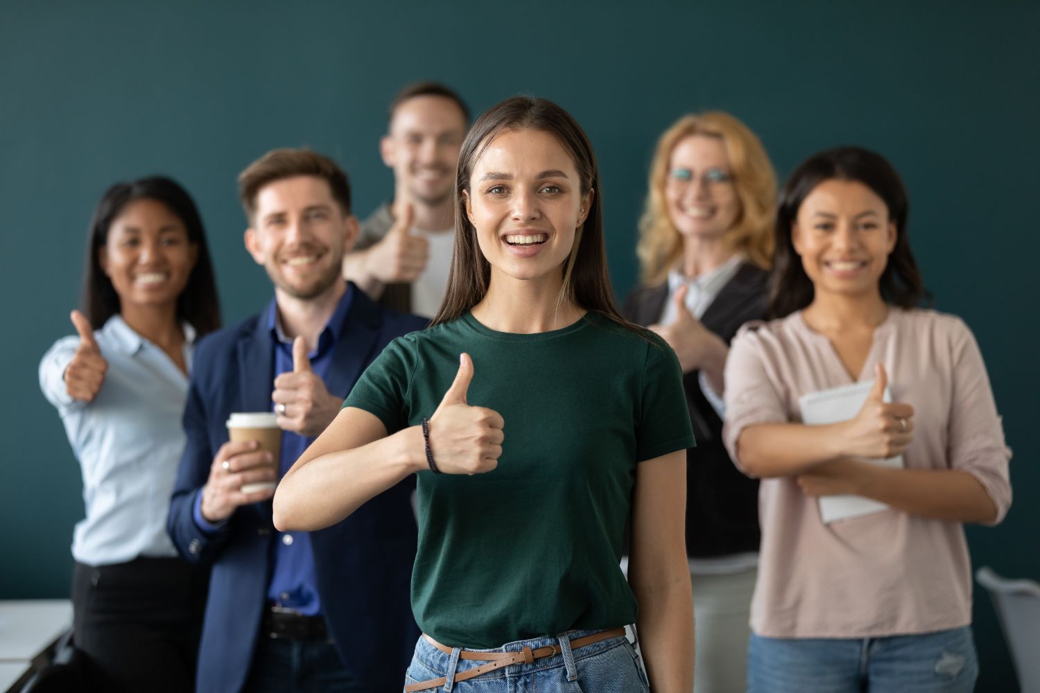 marketing team thumbs up group photo